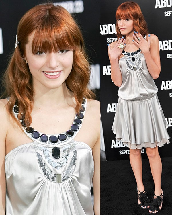 Bella Thorne dazzles in a silver embellished dress with statement jewelry and feathered heels at the Abduction premiere