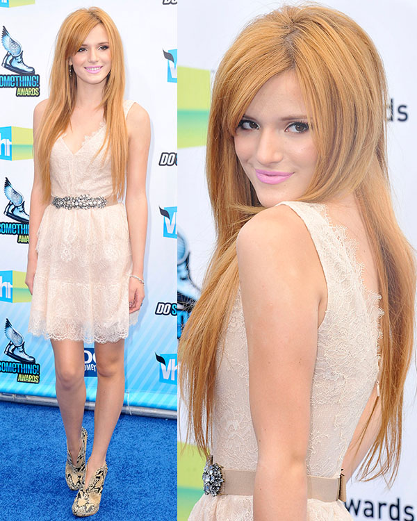Bella Thorne looks lovely in a lace blush dress paired with statement snakeskin heels at the Do Something Awards