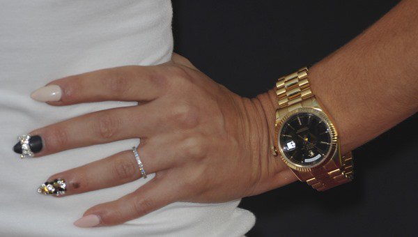 Cara Santana showing off her nails, watch, and rings