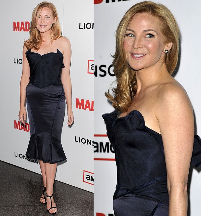 Jennifer Westfeldt wears her blonde hair in soft curls while showcasing a strapless navy dress paired with strappy black T-strap stilettos