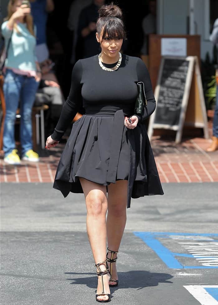 Pregnant Kim Kardashian goes to her car