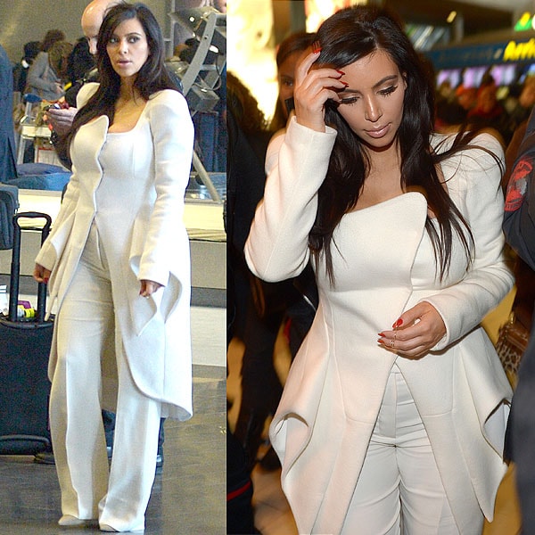Kim Kardashian arrives at Charles de Gaulle Airport in Paris on March 2, 2013, wearing a sculptural Mugler Fall 2012 white coat layered over a monochromatic ensemble and finishing the look with nude suede Jimmy Choo “Anouk” pumps