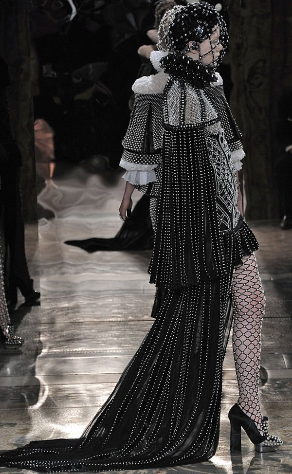 Model wearing a bejeweled headdress at the Alexander McQueen Autumn Winter 2013 fashion show