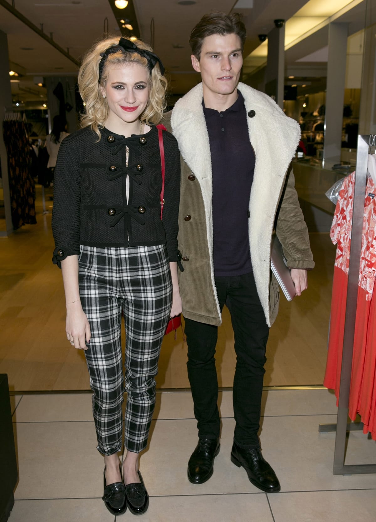 Oliver Cheshire (L) and Pixie Lott attend the Panasonic Technics 'Shop To The Beat' Party hosted by George Lamb at French Connection, Oxford Circus, on March 13, 2013 in London, England.