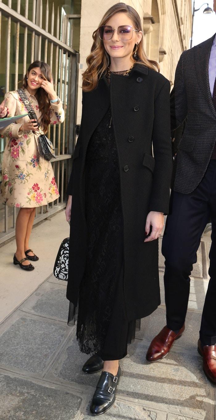 Olivia Palermo exudes elegance at the Dior Presentation during Paris Fashion Week, showcasing a stunning Dior Fall 2019 black lace dress paired with sophisticated Santoni double-buckle leather loafers