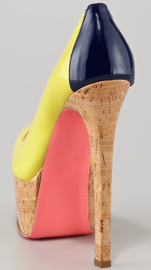 A navy patent heel counter, towering cork stiletto, and pop-pink underside give the Ruthie Davis platform pump a playful, colorblocked twist from every angle