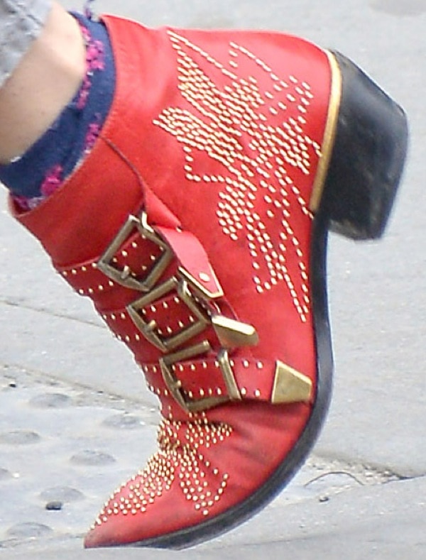 Sienna Miller wearing red Chloé 'Suzanne' stud buckle booties