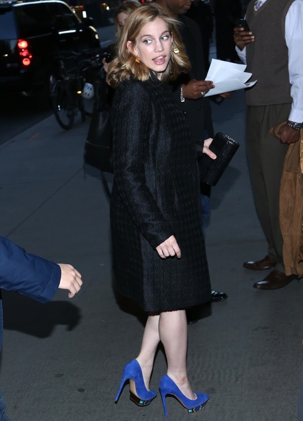 Anna Chlumsky steps out in a chic black coat paired with bold cobalt blue platform heels