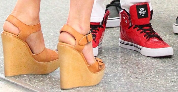 Zooming in on elegance: A detailed view of Victoria Beckham's stylish tan spring wedge sandals