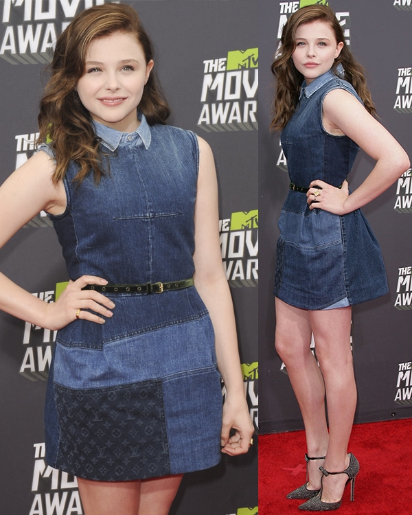 Chloë Moretz exudes youthful charm in a sleeveless Louis Vuitton denim patchwork dress, cinched with a slim black belt for a chic and edgy red carpet look at the 2013 MTV Movie Awards