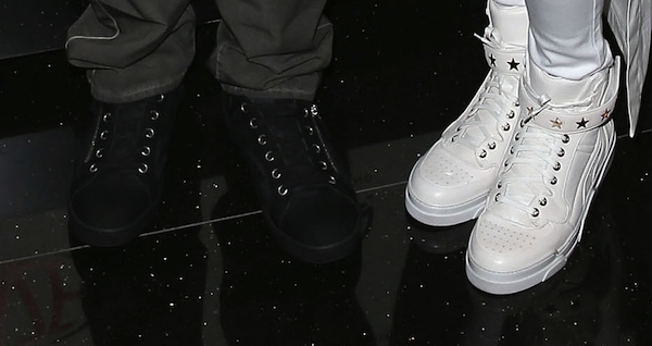 Future’s black Givenchy high-top sneakers contrast sharply with Ciara’s white pair, underscoring the couple’s coordinated yet opposing monochrome styling