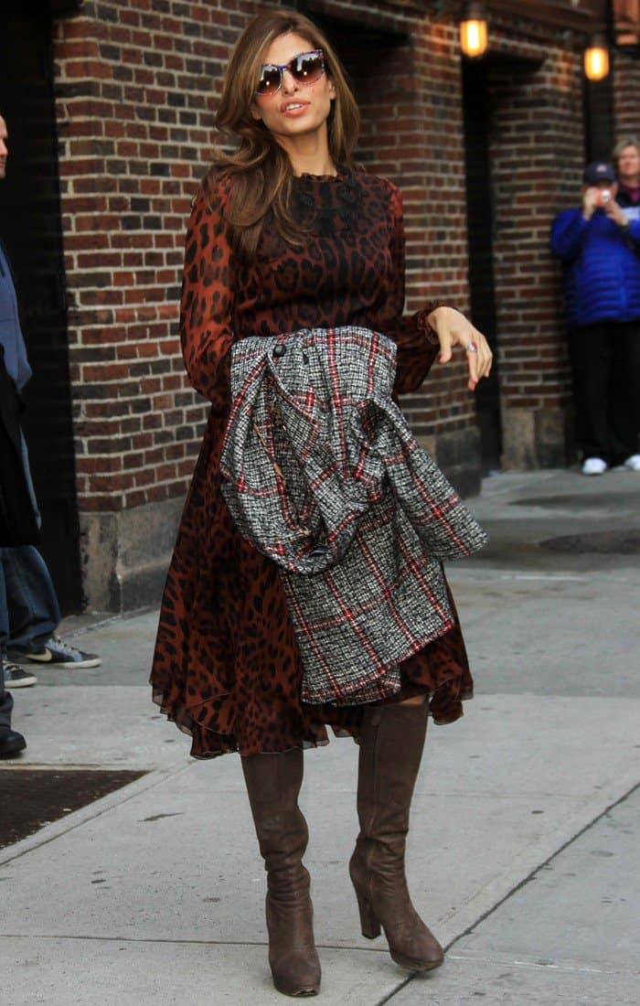 Eva Mendes turned heads by pairing brown suede boots with a striking leopard-print Dolce Gabbana maxi dress during her appearance on the Late Show with David Letterman