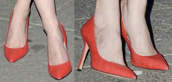 A closer look at Gretchen Mol’s red pointed-toe pumps, a classic high-heel silhouette that adds a bold color contrast to her minimalist black dress