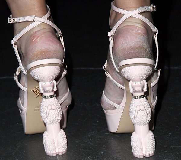 Holly Madison's playful Charlotte Olympia sandals, with their distinctive poodle heels, underscore how visible feet are in open footwear, making regular moisturizing a key part of finishing your look