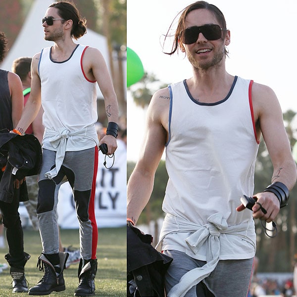 Jared Leto brought a sporty edge to Coachella with a color-blocked tank, joggers with bold side stripes, combat boots, and a casual sweatshirt tied at the waist