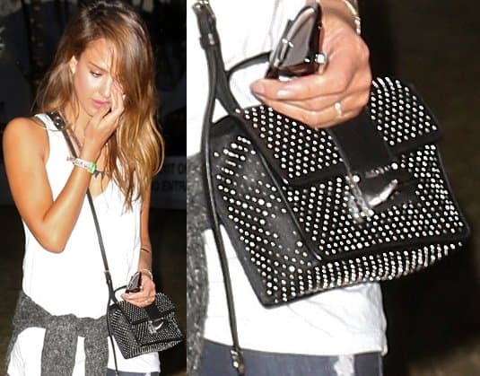 Close-up of Jessica Alba's stylish choice at Coachella: the black Jimmy Choo Rebel bag, a perfect blend of luxury and festival vibe
