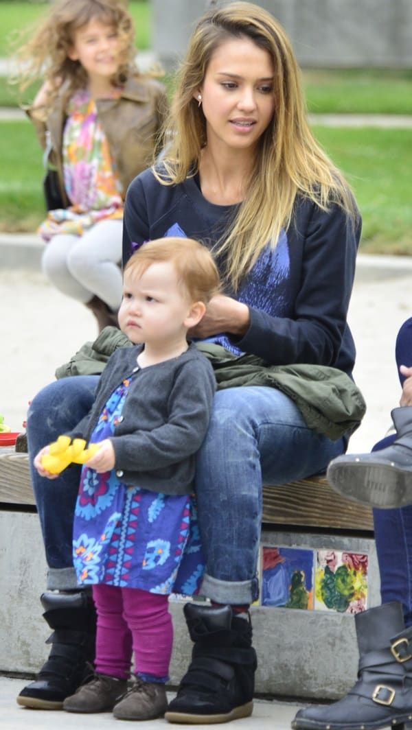 Jessica Alba was spotted at Coldwater Park in Beverly Hills on April 14, 2013, sporting a casual look with Current/Elliott Write-on rolled skinny jeans and Isabel Marant Bekett high top suede sneakers
