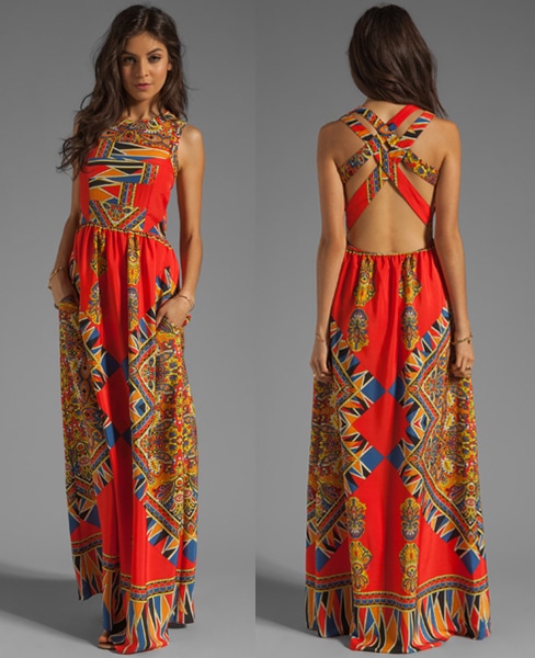 Lovers + Friends “Kitty Cat” Printed Maxi Dress, originally priced at $206, featuring a vibrant geometric motif and striking crisscross open-back design that adds a bold, architectural edge to its breezy silhouette