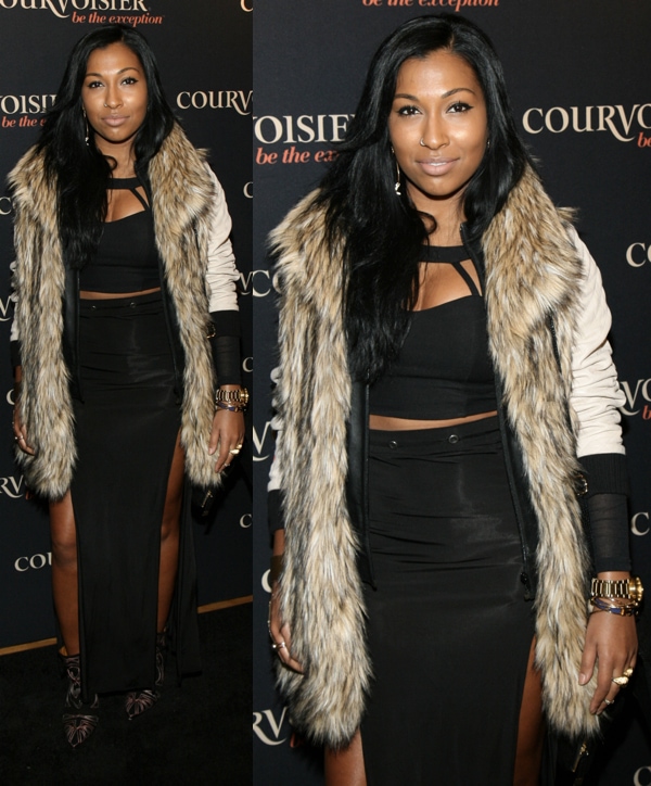 Melanie Fiona wears pointed-toe Isabel Marant cowboy-inspired ankle boots with a high-slit black maxi skirt and cutout top at the “Courvoisier Kicks Off Courvoisiology” event on April 5, 2013, at SIR Stage 37 in New York City, using the angled heel and sharp toe to elongate her silhouette beneath the flowing layers