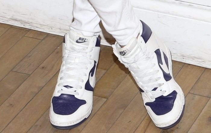 Jessica Hart completes her look with classic Nike high-top sneakers in white and navy