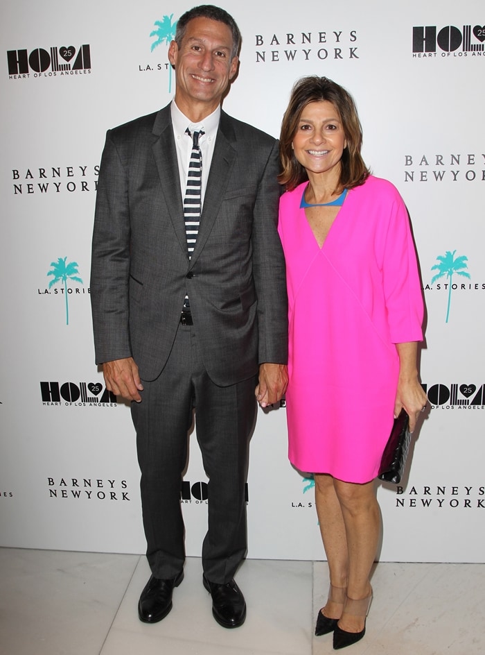 Lisa Perry, a fashion designer known for her vivid, '60s-inspired creations, is elegantly paired with her husband, Richard Cayne Perry