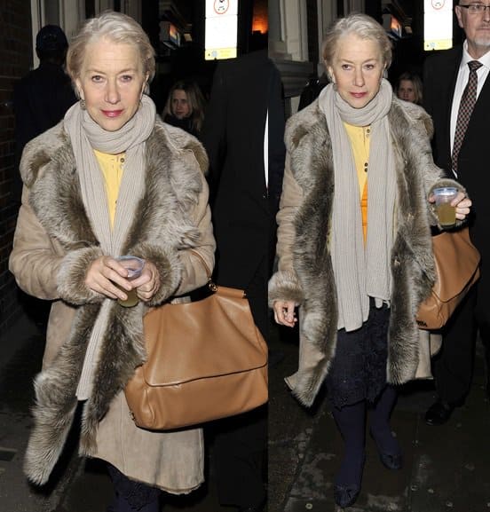 Dame Helen Mirren wears a cozy fur-trimmed coat paired with a beige Dolce Gabbana Miss Sicily bag while exiting the Gielgud Theatre