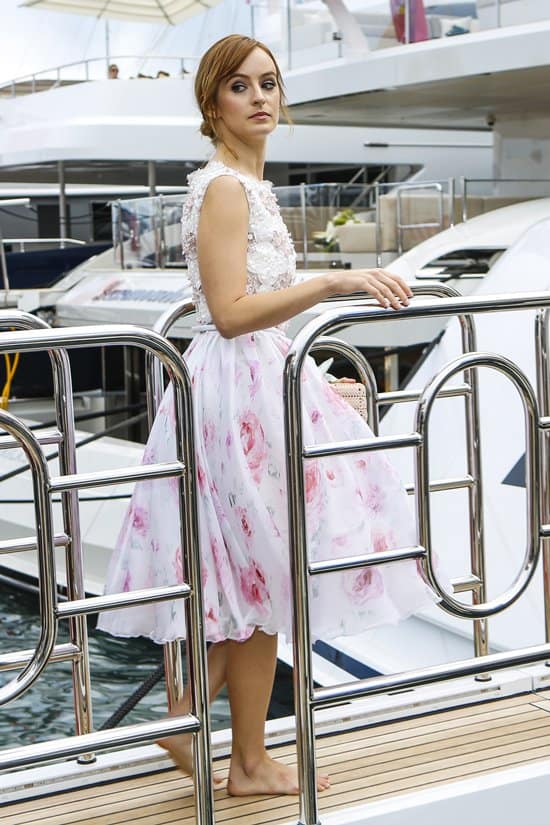 Barefoot at the 66th Cannes Film Festival, Ahna O’Reilly glides along the marina in a romantic Georges Hobeika floral gown, embodying effortless springtime elegance on May 19, 2013