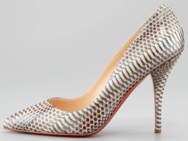 Christian Louboutin’s “Batignolles” pump showcases its striking snakeskin texture and signature red sole, blending luxury craftsmanship with bold, sculptural design