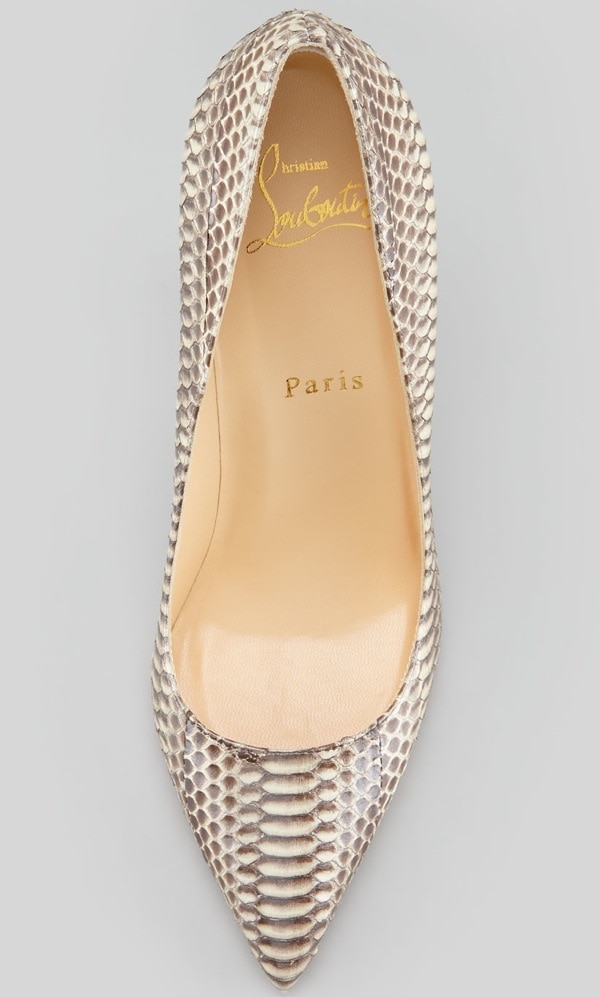 Christian Louboutin’s “Batignolles” pump showcases its striking snakeskin texture and signature red sole, blending luxury craftsmanship with bold, sculptural design