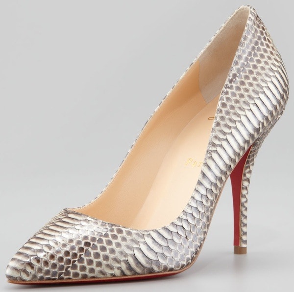 Christian Louboutin’s “Batignolles” pump showcases its striking snakeskin texture and signature red sole, blending luxury craftsmanship with bold, sculptural design