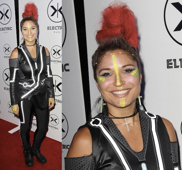 DJ Rap looking futuristic in her black and reflective ensemble