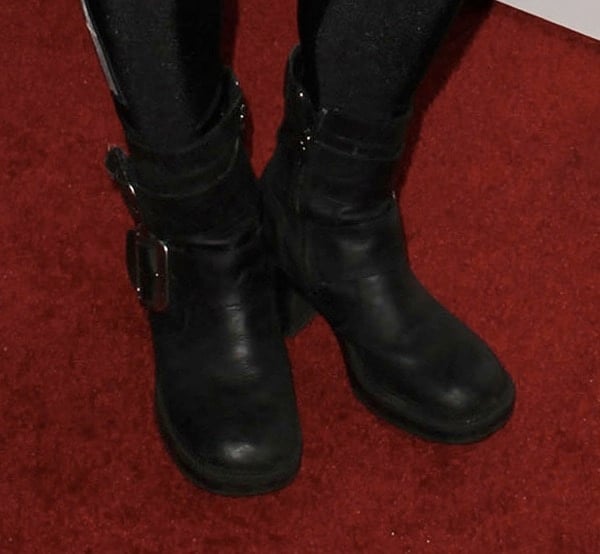 Buckled biker boots complementing DJ Rap's outfit