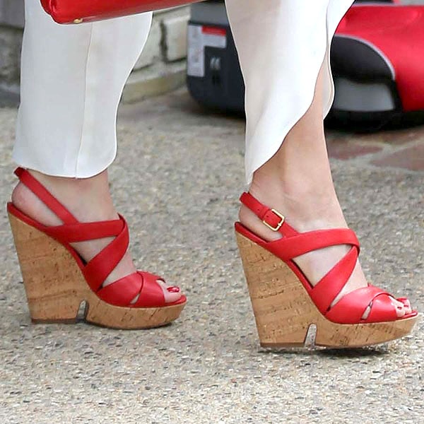 Gwen Stefani added a pop of color with bold red cork wedge sandals