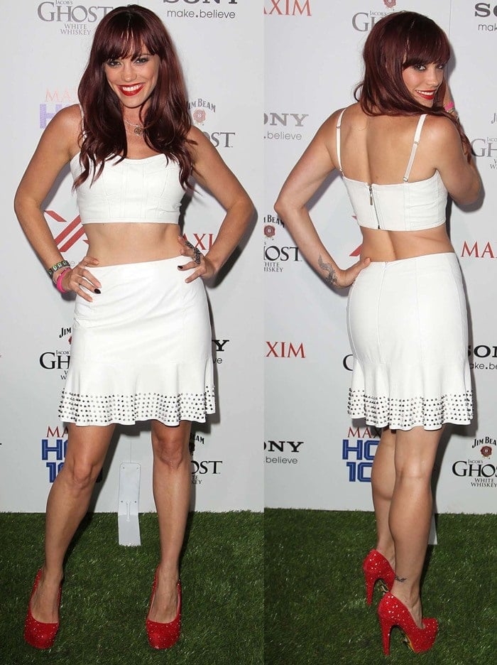 Jessica Sutta embraced retro-meets-glam energy in a white two-piece set with silver stud detailing, punctuated by glittering red Taylor Says “Lookie” pumps that added a bold, playful pop to her monochrome look