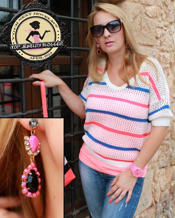 Katarzyna's pink earrings featuring a black stone and clear crystals