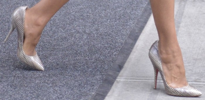A closer look at Kerry’s Christian Louboutin “Batignolles” pumps reveals their luxurious snakeskin finish and signature red soles