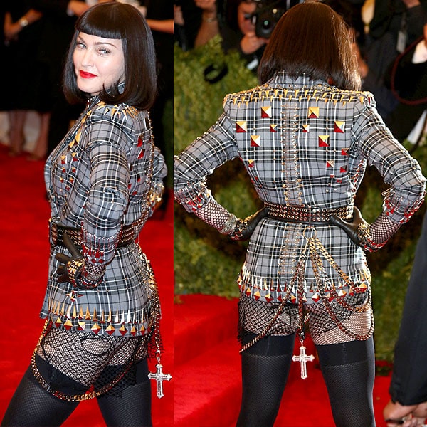 Madonna was the embodiment of punk in her studded plaid jacket, lock choker necklace, safety pins, chain belts, and fishnet stockings