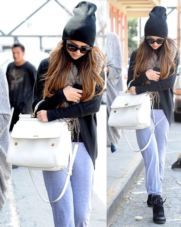Selena Gomez rocks a Bdg Cooperative two-way scarf, sweatpants, Dolce Gabbana Dg4149 sunglasses, and Top Moda Sammy 6 velcro high top sneakers
