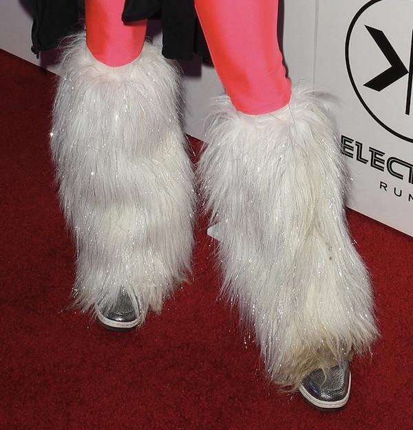 Vanessa Hudgens in fur calf covers and metallic silver Nike sneakers