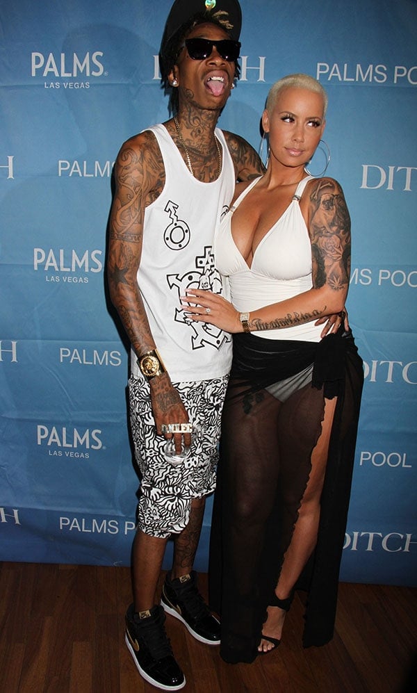 Joined by Wiz Khalifa, Amber Rose looked amazing in a one-piece swimsuit and high heels
