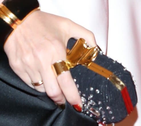 Kylie Minogue added a touch of sparkle to her ensemble at the Met Gala with a crystal-studded clutch