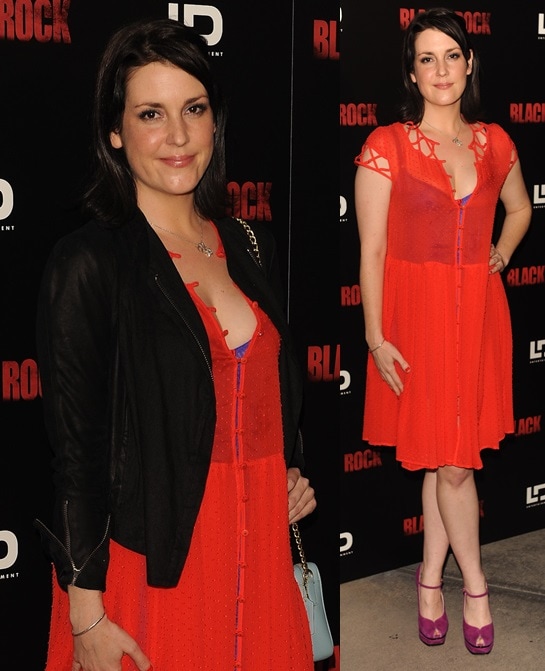 Melanie Lynskey adds a vivid pop of color to the Black Rock premiere in a flowing coral-red dress layered under a cropped black jacket