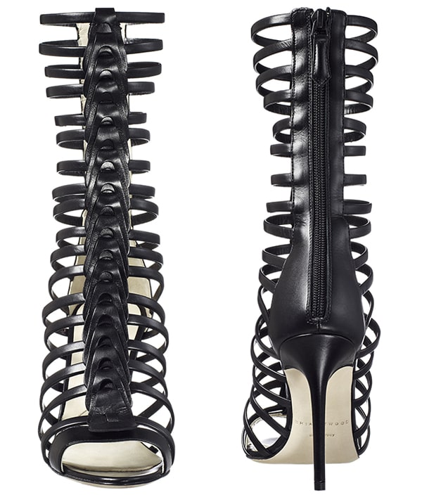 Brian Atwood’s “Isabeli” gladiator sandals feature slim leather straps with sculpted T-bar detailing, a back zip for ease, and a towering stiletto heel that delivers graphic impact from every angle