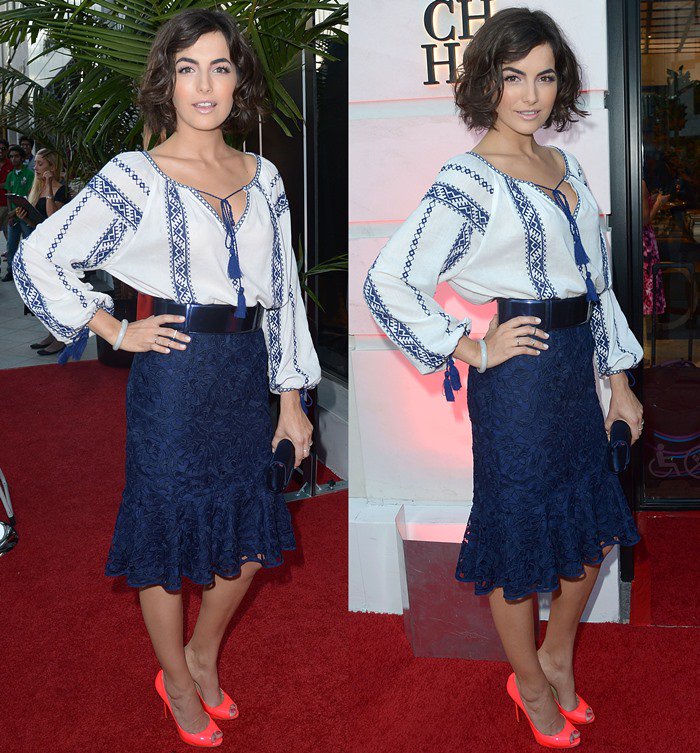 Camilla Belle exudes effortless elegance in a bohemian-inspired blouse and navy lace skirt, accented by bold neon heels