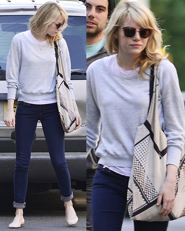On June 19, 2013, in New York, Emma Stone styled a casual chic look featuring AG Adriano Goldschmied legging jeans, Chloe Lauren scalloped ballet flats, Rag  Bone Monroe sunglasses in matte tortoise, and a Twelfth St. by Cynthia Vincent silk printed tote bag