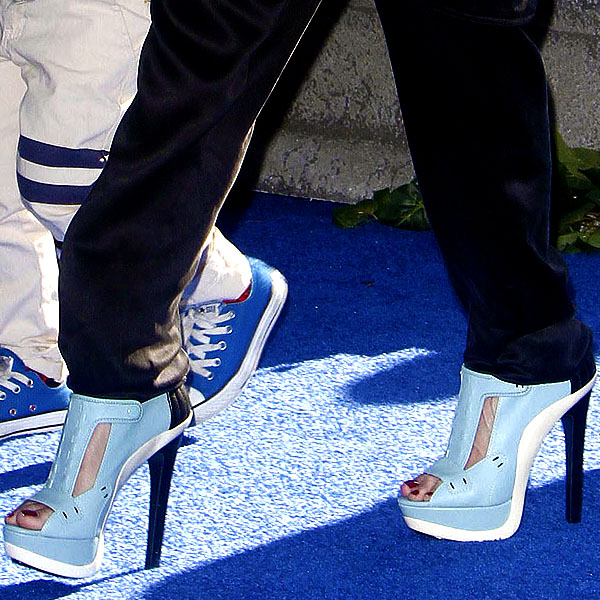 Gwen Stefani's baby blue open-toe sandal booties steal the spotlight with their bold cutout design, sleek stiletto heel, and sky-high platform