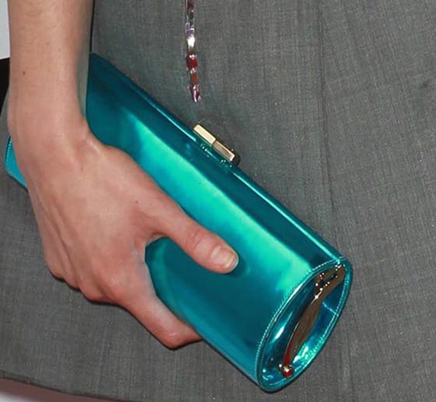 Krysten Ritter added a splash of color with a metallic-blue Jimmy Choo 'Tube' clutch
