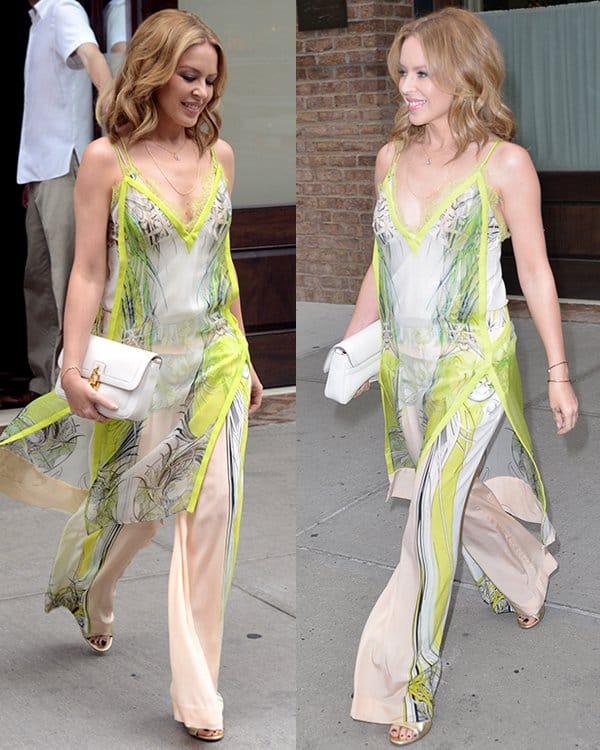Kylie Minogue steps out in Manhattan wearing a breezy printed silk chiffon dress layered over matching wide-leg pants from Roberto Cavalli’s Spring 2013 collection, styled with open-toe gold heels and a white clutch for a chic daytime look