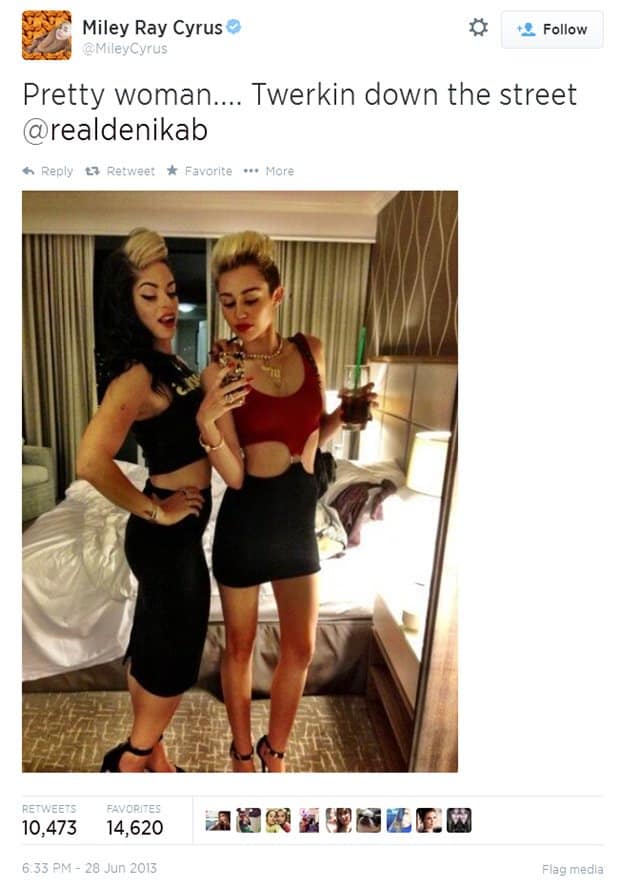 Miley Cyrus poses in a bold Tripp NYC cutout “Pretty Woman” dress paired with black ankle-strap stiletto sandals, showing off her edgy club-ready style