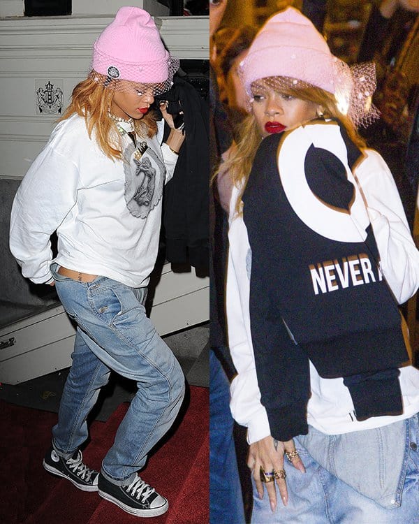 Rihanna sets a casual trend with her overalls stylishly worn half-down, complemented by an oversized sweater, during a day out in Amsterdam